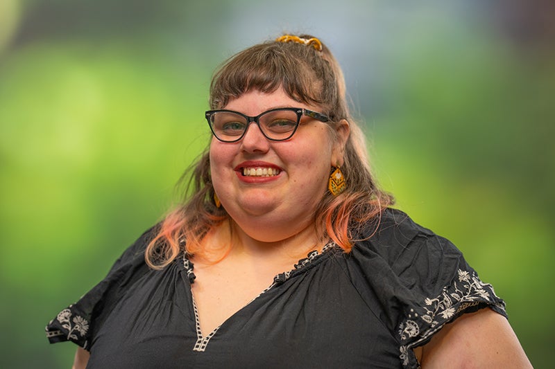 Woman with long blond hair smiling